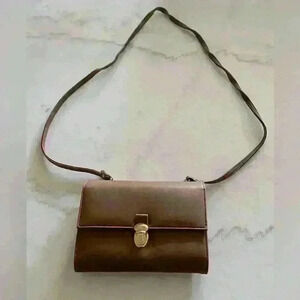 Rossetti brown crossbody women’s purse new without tags. Excellent condition.